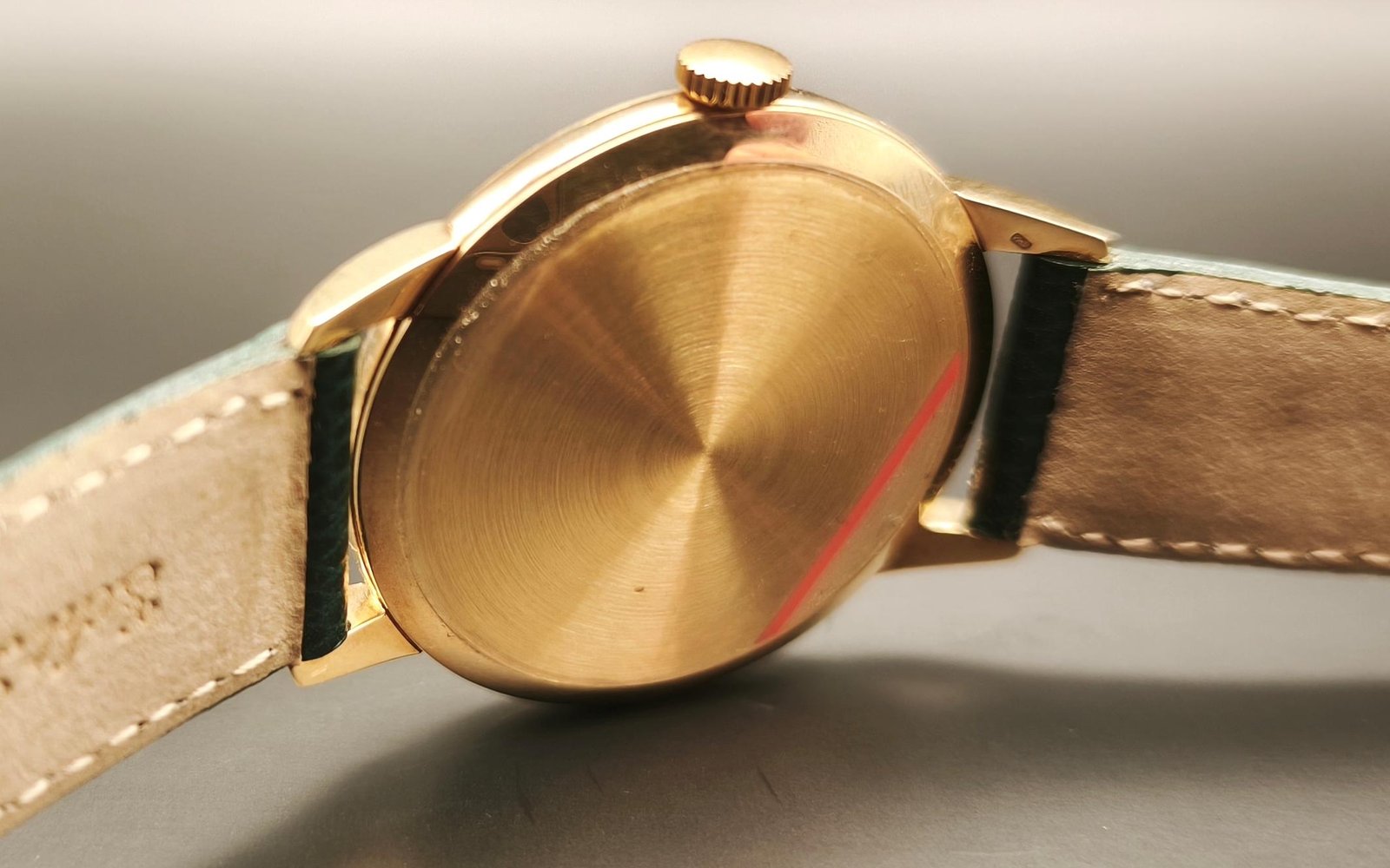 Vintage Omega 18K gold mechanical watch from 1952 showcasing classic watch design with handcrafted movement, aged dial with vintage watch patina, and timeless craftsmanship from private watch collection