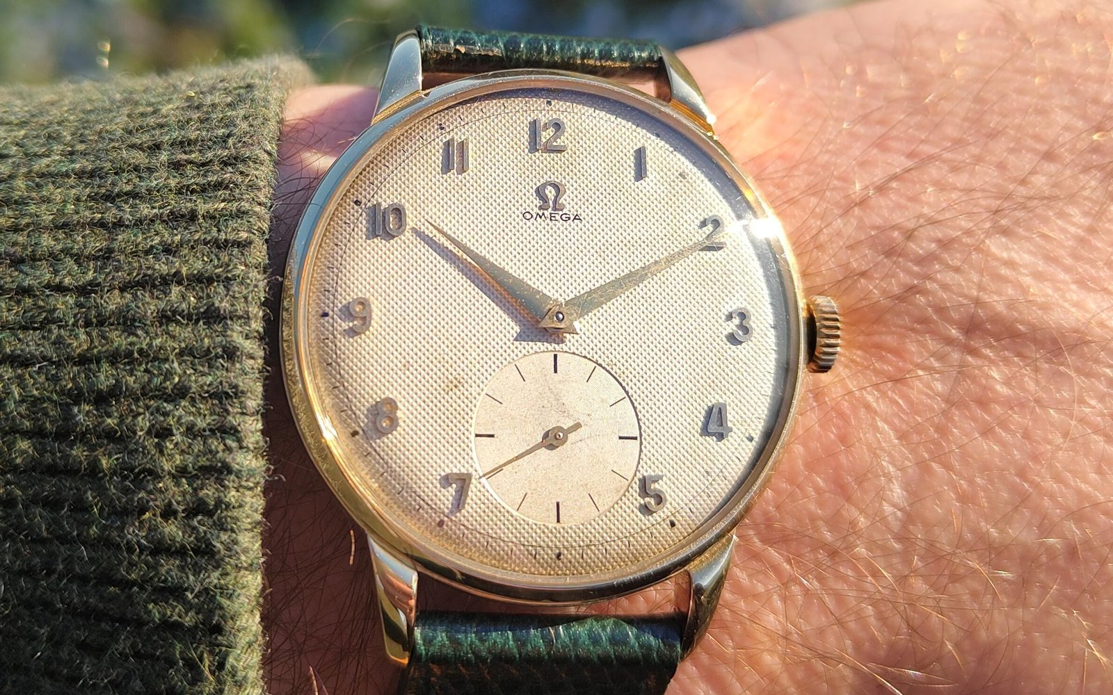 Vintage Omega 18K gold mechanical watch from 1952 showcasing classic watch design with handcrafted movement, aged dial with vintage watch patina, and timeless craftsmanship from private watch collection