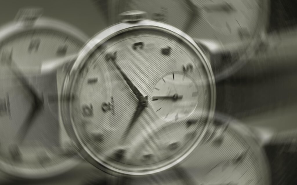 Motion-blurred vintage watches showing passage of time, mechanical watches in artistic blur symbolizing time's movement, horology photography capturing fleeting moments