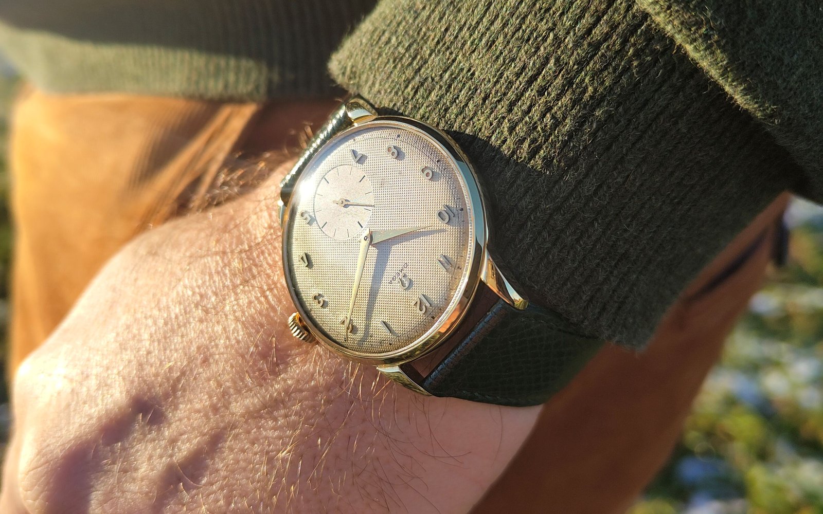 Vintage Omega 18K gold mechanical watch from 1952 showcasing classic watch design with handcrafted movement, aged dial with vintage watch patina, and timeless craftsmanship from private watch collection