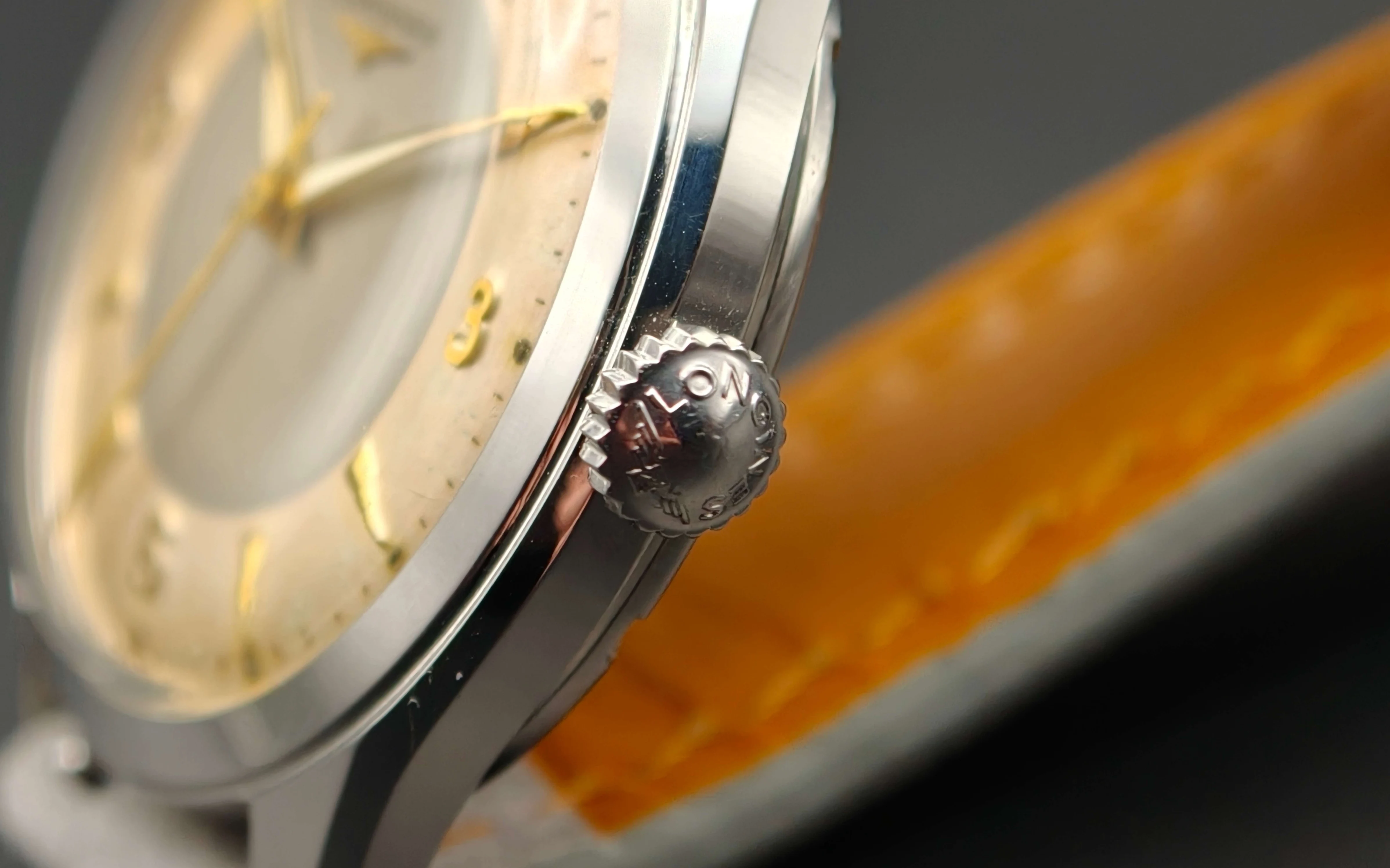 Vintage Longines stainless steel mechanical watch from 1954 showcasing classic watch design with handcrafted movement, aged two-tone dial with warm tropical patina, and timeless craftsmanship from private watch collection.